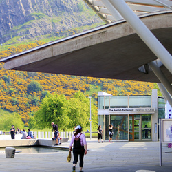 View of the Public Entrance of the Scottish Parliament on Horse Wynd with Salisbury Crags in the background