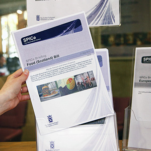 A person holding a research document.