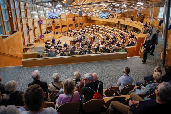 a group of people seated in the public gallery of the debating chamber