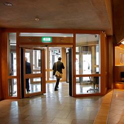 Person exiting the Scottish Parliament